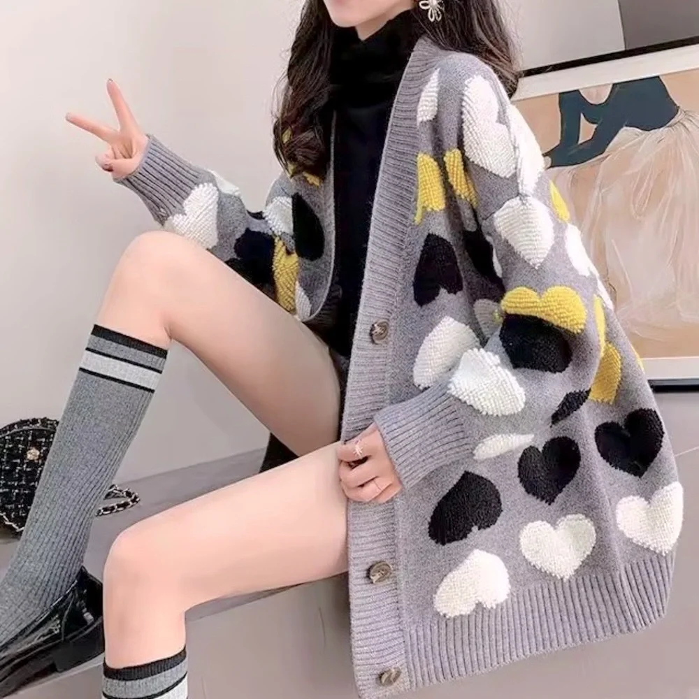 Gray button up cardigan sweater with plush heart pattern